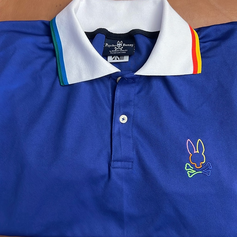 Psycho Bunny Blue with white Rainbow trim Collar and Bunny Outline NWOT